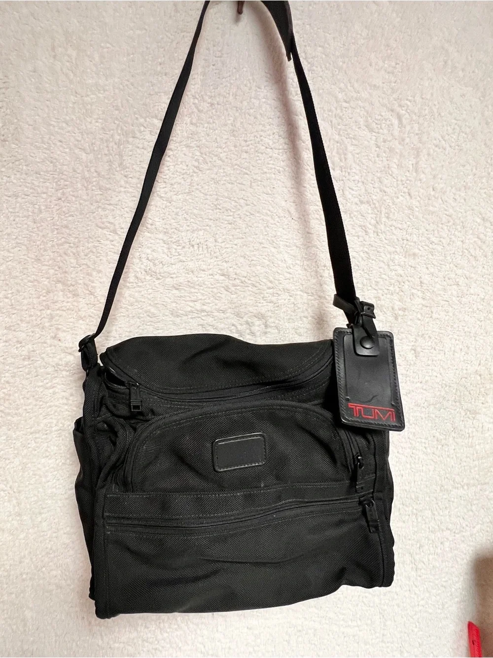 Tumi Black Nylon Messenger Bag with Red Logo Tag